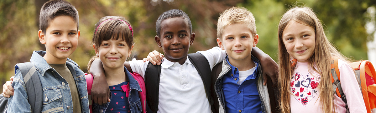 Group of happy elementary friends together